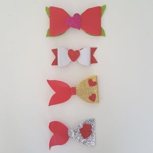 4 Girl faux leather bows.